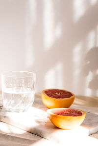 Close-up of orange juice on table