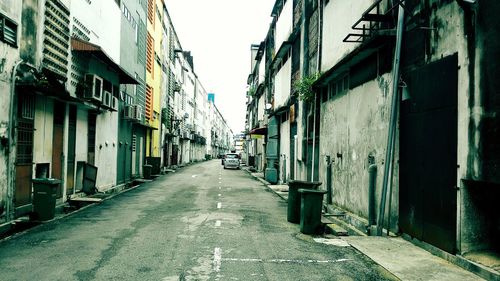 Street amidst residential buildings