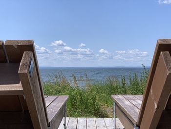 Scenic view of swimming pool by sea against sky