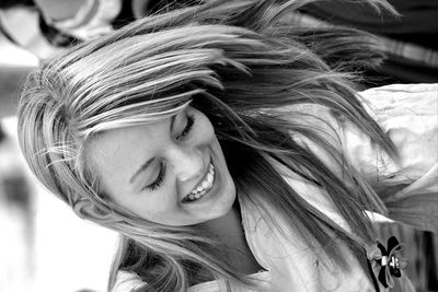 Close-up portrait of a smiling young woman