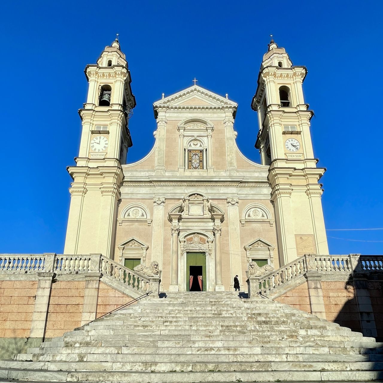 architecture, built structure, building exterior, religion, place of worship, belief, sky, travel destinations, landmark, building, spirituality, blue, clear sky, history, the past, historic site, nature, travel, tower, low angle view, sunny, day, staircase, worship, tourism, catholicism, facade, city, no people, outdoors, sunlight, ancient history