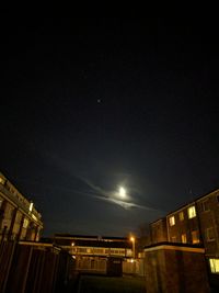 Low angle view of illuminated city at night