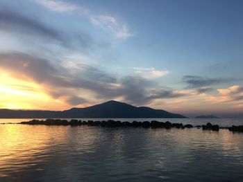 Scenic view of lake against sky during sunset