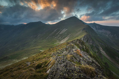 Scenic view of mountains against sky during sunset