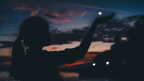 Portrait of silhouette girl against sky during sunset