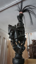 Close-up of statue against wall