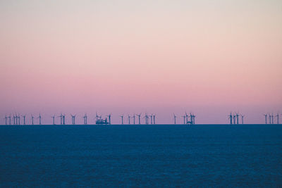 Scenic view of sea against clear sky during sunset