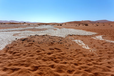 Scenic view of desert against clear sky