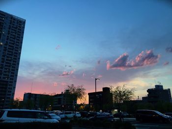 Buildings in city at sunset