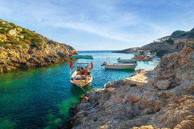 Boats in sea against sky