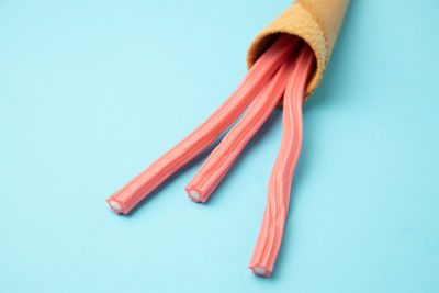 High angle view of fork on table against white background