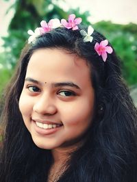 Close-up portrait of a smiling young woman