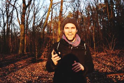 Portrait of young woman in forest