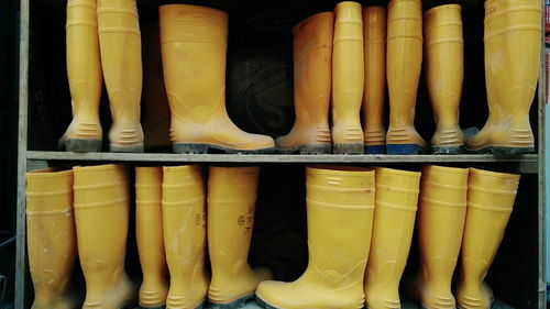 Rubber boots on shelf for sale