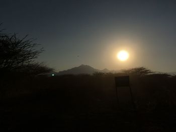 Scenic view of silhouette mountains against sky at sunset