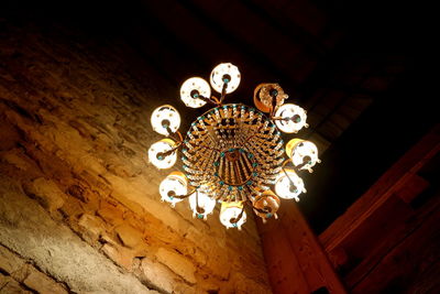Low angle view of illuminated chandelier