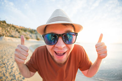 Portrait of smiling man wearing sunglasses