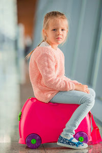 Cute girl sitting outdoors