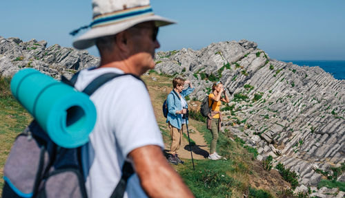 Family practicing trekking outdoors. selective focus on women in background