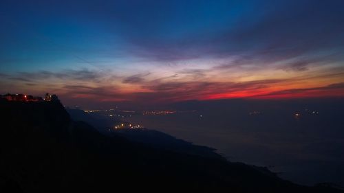 View of illuminated cityscape at dusk