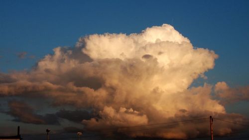 Low angle view of vapor trails in sky