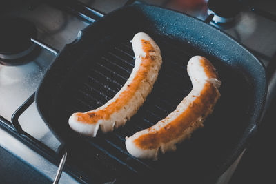 High angle view of meat on barbecue grill