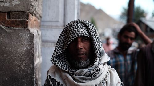 Portrait of man looking at camera