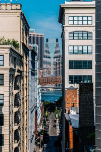 Buildings in city against sky