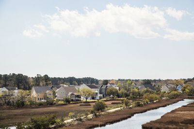 Houses in town against sky