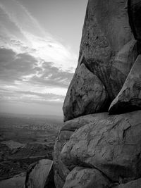 Close-up of rock formation against cloudy sky