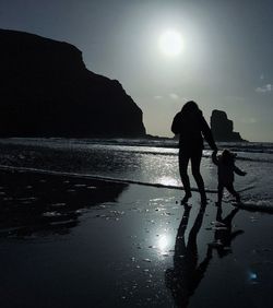Silhouette of woman in sea