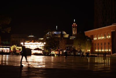 Illuminated buildings in city at night
