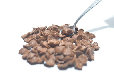 Close-up of bread against white background