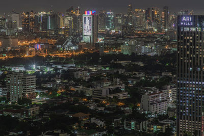 High angle view of illuminated buildings in city at night