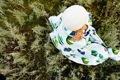 High angle view of girl wearing hat