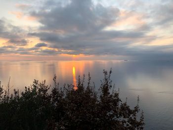 Scenic view of lake against sky during sunset