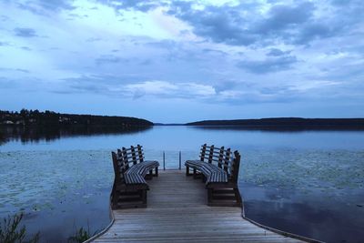 Pier over lake against sky