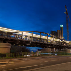 Bridge over river against blue sky