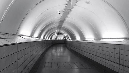 Man in illuminated tunnel