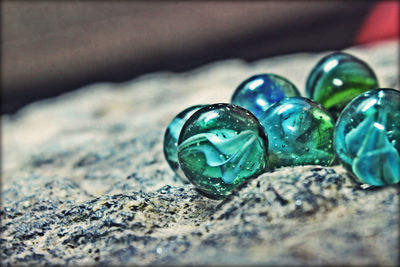 Close-up of marbles on rock