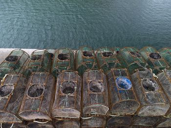 Fishing crab traps stacked and loaded ready to be set out at sea to catch crabs and shell fish.