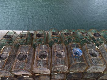 Fishing crab traps stacked and loaded ready to be set out at sea to catch crabs and shell fish.