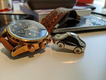 High angle view of clock on table