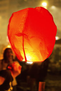 Close-up of hot air balloon against orange sky