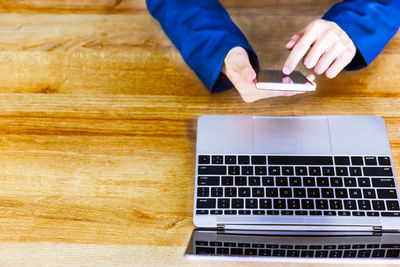 High angle view of man using laptop on table