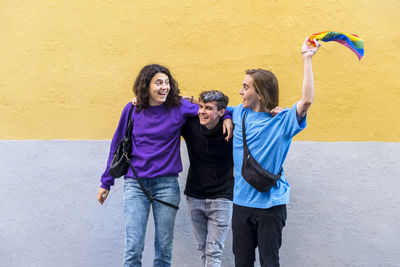 Young diverse friends talking outdoors on the street.