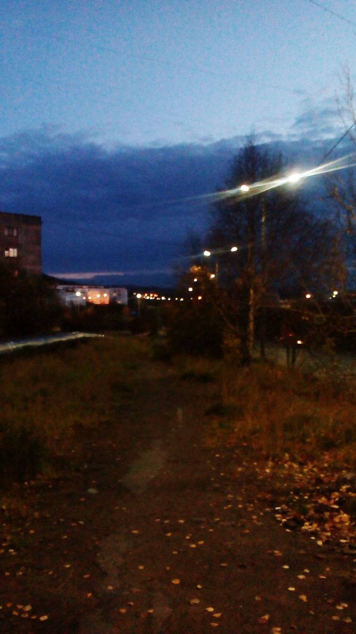 VIEW OF ILLUMINATED BUILDINGS AT NIGHT