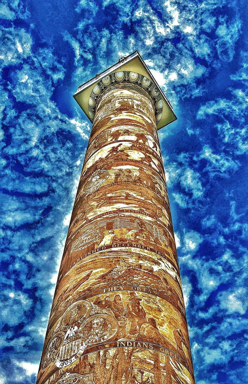 low angle view, tower, landmark, architecture, built structure, sky, no people, blue, building exterior, nature, cloud, day, outdoors, the past, history, building, lighthouse