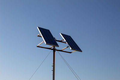 A solar panels with the background of a cloudless sky