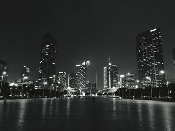 Low angle view of illuminated city at night